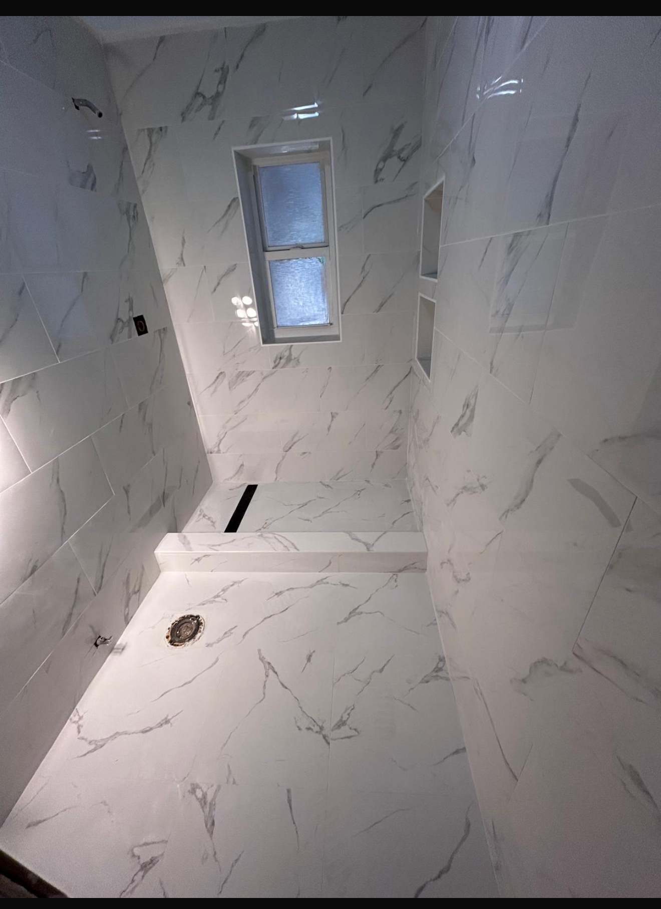 Professional bathroom renovation with marble tiles by J's 24 Hour Service